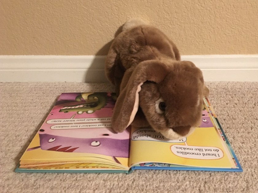 Caramel is reading one of his favorite pages in The Cookies Fiasco by Dan Santat.