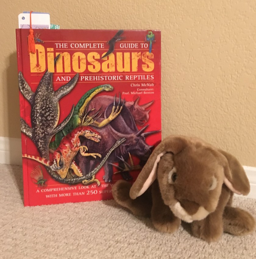 Caramel loves reading and looking at the many many pictures in The Complete Guide to Dinosaurs and Prehistoric Reptiles.﻿