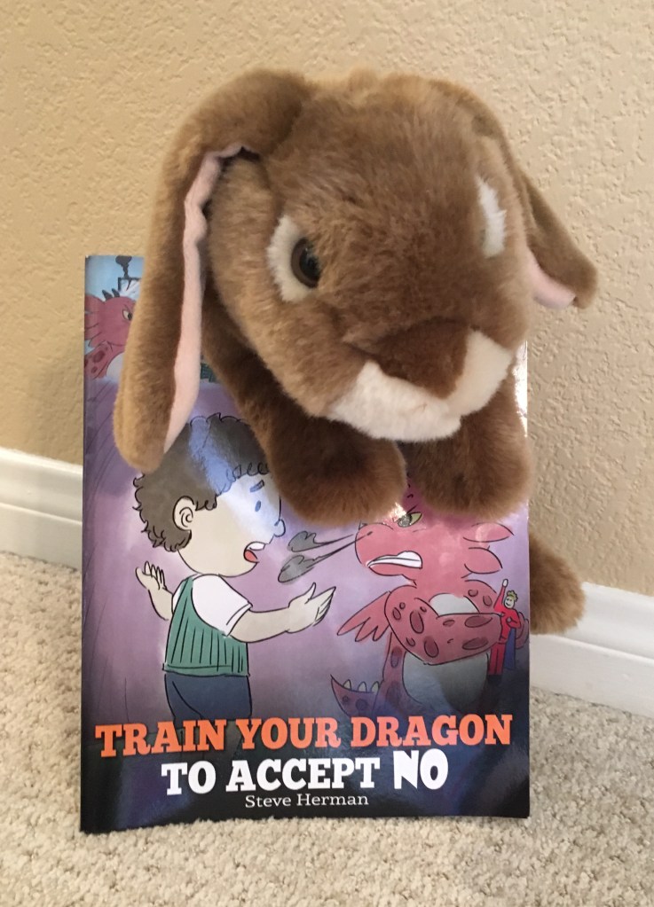 Caramel enjoyed reading Train Your Dragon To Accept NO by Steve Herman and thinks he might actually try the advice given there about calming down when someone says no.