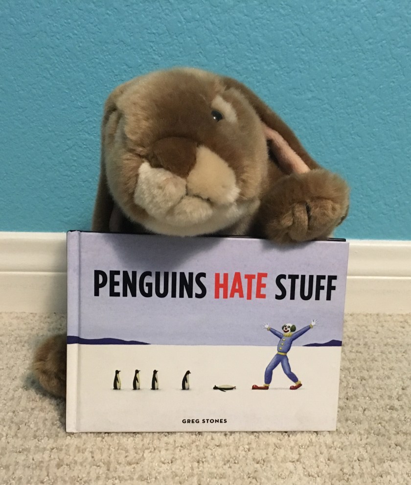 Caramel loves turning the pages of Penguins Hate Stuff by Greg Stones and rediscovering yet another ridiculous thing penguins hate!