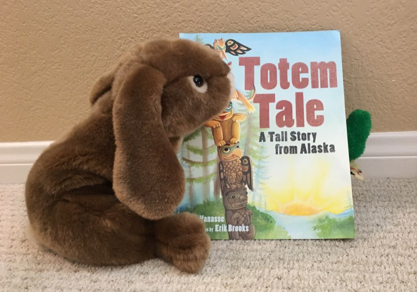 Caramel invited a green friend to read Totem Tale: A Tall Story from Alaska. Can you see him?