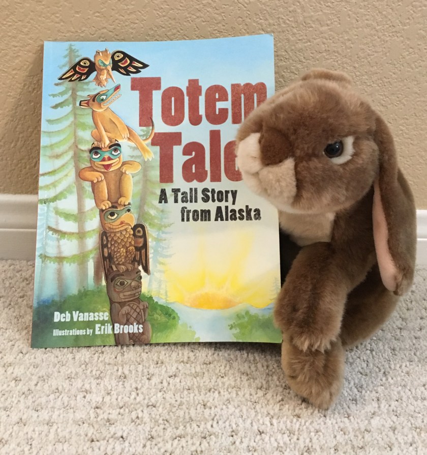 Caramel loves to read and reread Totem Tale: A Tall Story from Alaska written by Deb Vanasse and illustrated by Erik Brooks.
