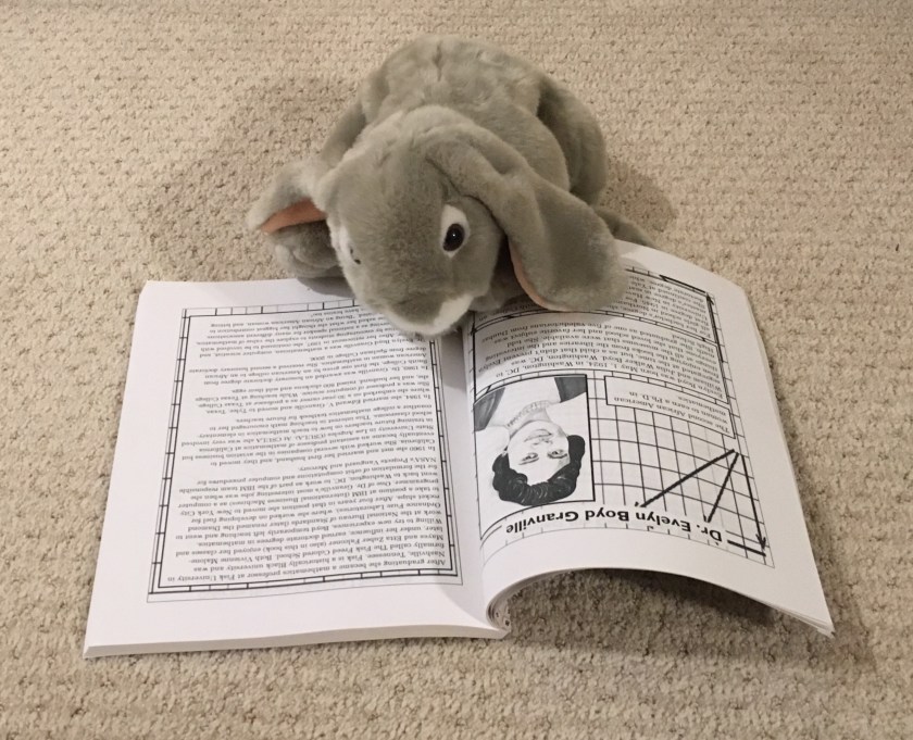 Sprinkles is reading the pages about Dr. Evelyn Boyd Granville, the second African American woman to earn a PhD in mathematics.