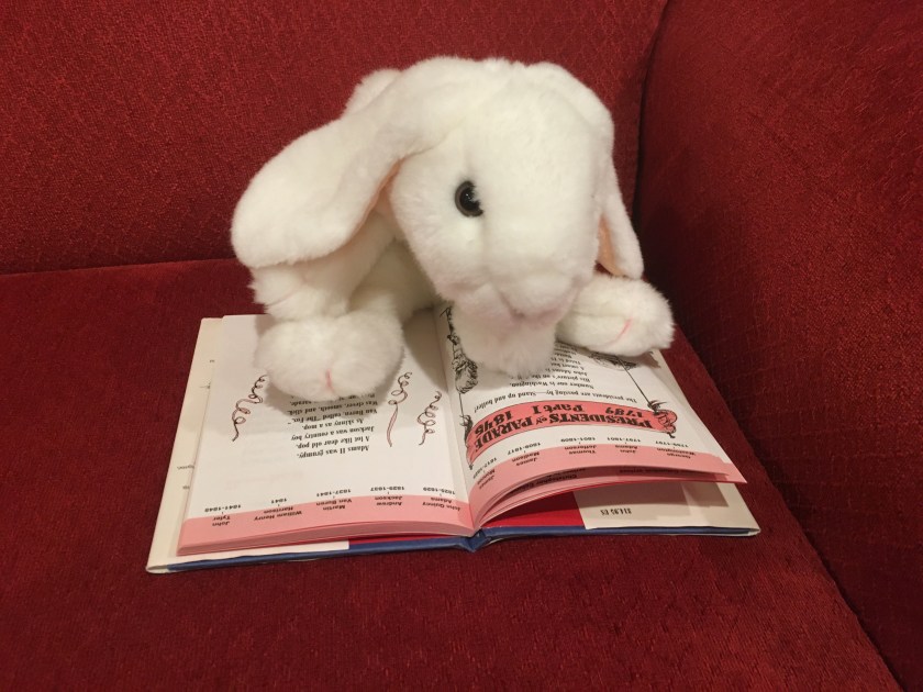 Marshmallow is reading one of the poems in BrainJuice: American History, Fresh Squeezed! written in poetic form by Carol Diggory Shields and illustrated by Richard Thompson. This is about the presidents. 