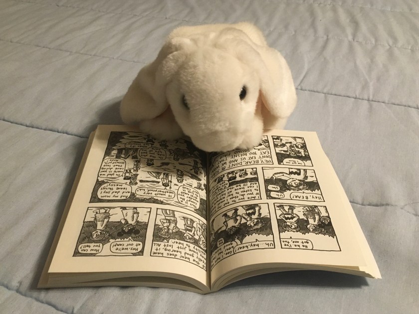 Marshmallow is reading Lucy and Andy Neanderthal: Stone Cold Age by Jeffrey Brown. 