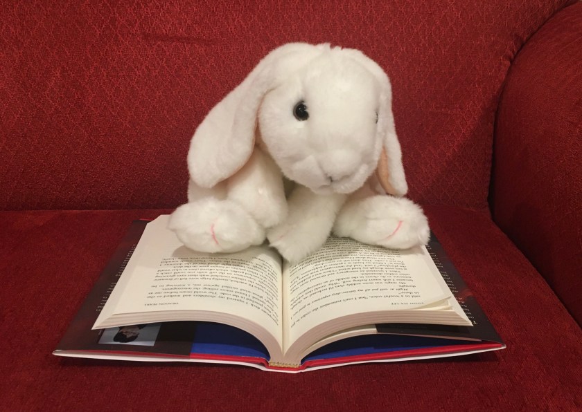 Marshmallow is reading Dragon Pearl by Yoon Ha Lee. 