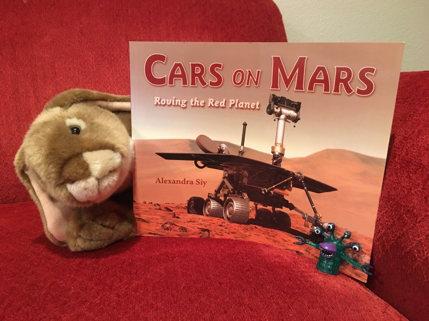 Caramel enjoyed reading Cars on Mars: Roving the Red Planet by Alexandra Siy with a Martian friend. Can you see this little alien?