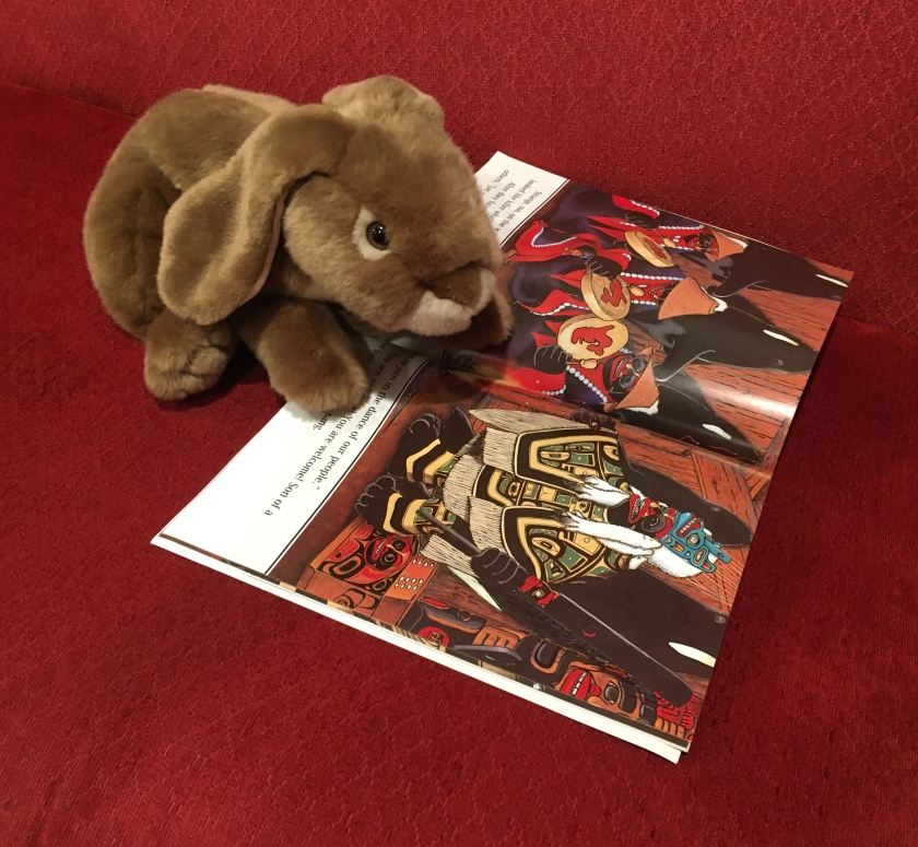 Caramel is looking at the part of Storm Boy by Paul Owen Lewis where the Haida prince is welcomed to the house of the chief of the killer whale people.
