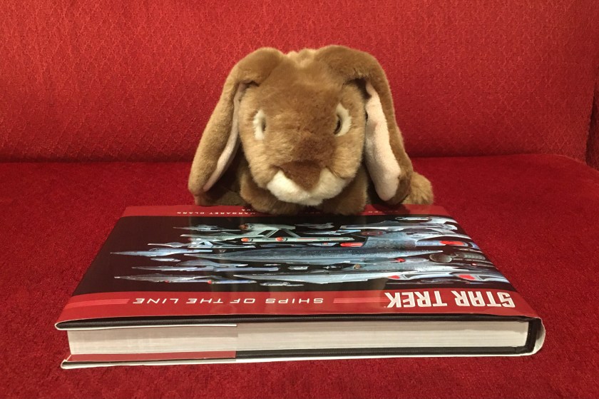 Caramel's favorite page of Star Trek: Ships of the Line, by Doug Drexler, Margaret Clark, and Michael Okuda, is the front cover, because it has all the ships all together all in one place. 