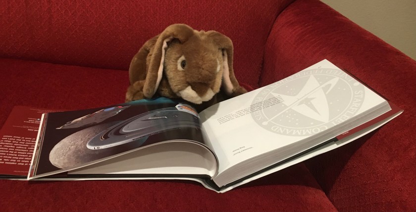 Caramel is checking out USS Voyager and the Delta Flyer in Star Trek: Ships of the Line, by Doug Drexler, Margaret Clark, and Michael Okuda.