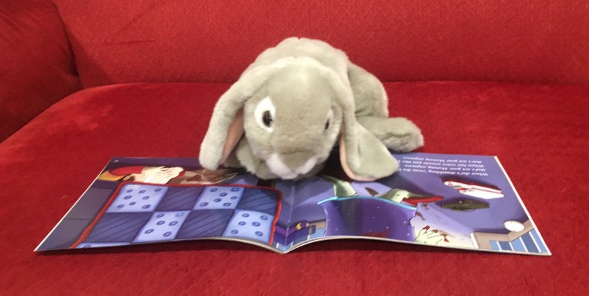 Sprinkles is reading That's Not Your Mommy Anymore: A Zombie Tale by Matt Mogk and Aja Wells: "If she doesn't seem like she did before, Maybe that's not your mommy anymore."