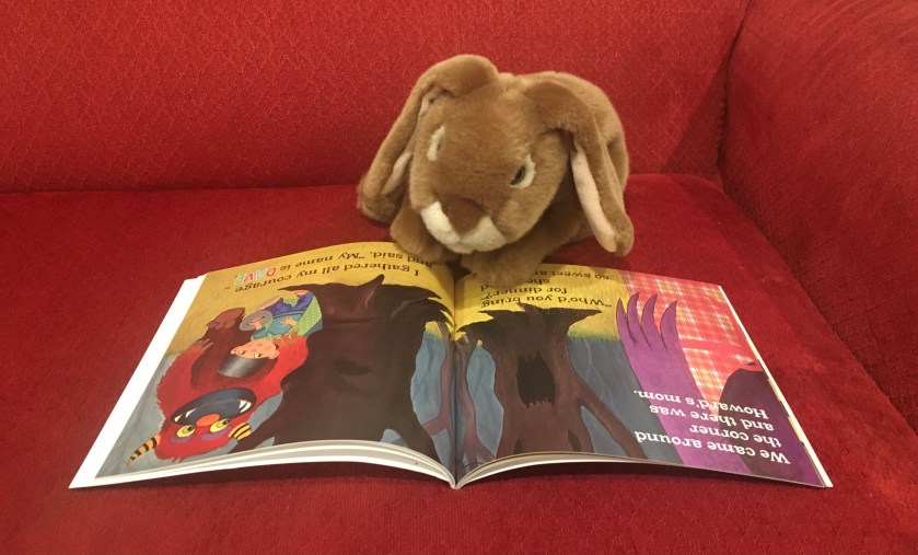 Caramel is reading The Monster in My Basement, written by Dave Preston and illustrated by Heather Lynn Harris. On these two pages, Dave meets Howard's mom.