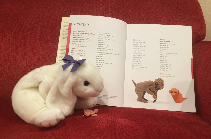 Marshmallow and Turtle are looking at the table of contents of Akira Yoshizawa: Japan’s Greatest Origami Master, with text, diagrams, and models by Akira Yoshizawa.