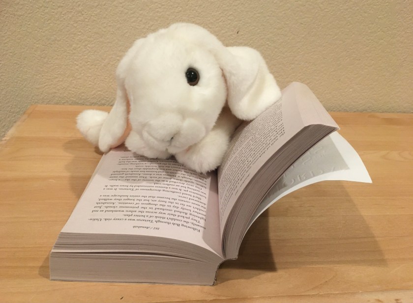 Marshmallow is reading The House of Hades (Book 4 of the Heroes of Olympus Series) by Rick Riordan.
