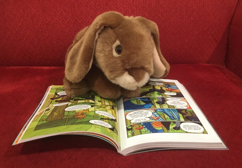 Caramel is reading The Dark Secret (Book Four of Wings of Fire) by Tui Sutherland and Mike Holmes.