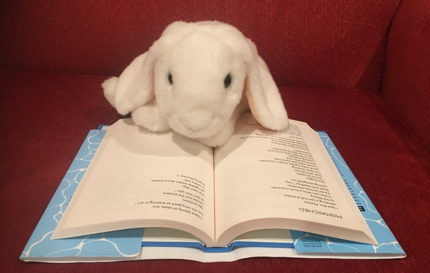 Marshmallow is reading Starfish by Lisa Fipps.