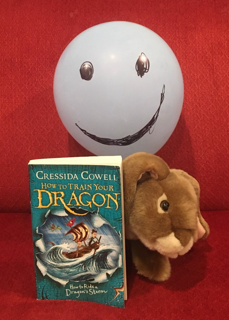 Caramel (and Mr. Balloon) loved reading How To Ride A Dragon's Storm (Book #7 of How to Train Your Dragon Series) by Cressida Cowell, and reviewing it for you. 
