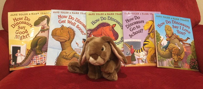 Caramel reviews How Do Dinosaurs Say Good Night? (2000), How Do Dinosaurs Get Well Soon? (2003), How Do Dinosaurs Eat Their Food? (2005), How Do Dinosaurs Go To School? (2007), and How Do Dinosaurs Say I Love You? (2009), all written by Jane Yolen and illustrated by Mark Teague. 