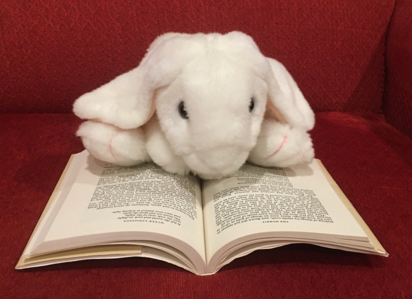 Marshmallow is reading The Hobbit by J.R.R. Tolkien.