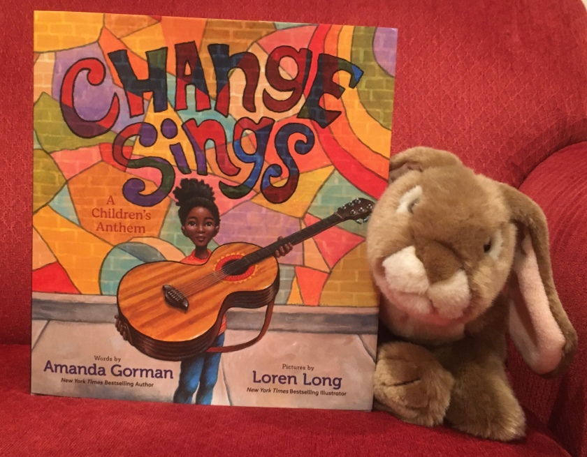 Caramel enjoyed reading Change Sings: A Children's Anthem, written by poet Amanda Gorman and illustrated by Loren Long, and recommends it to little bunnies who enjoy the sound of words and like to think about how they can make the world a better place.