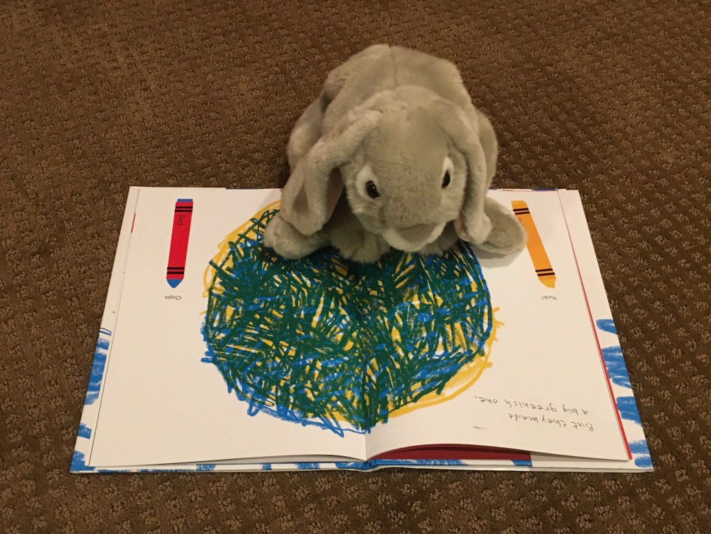 Sprinkles is reading Red: A Crayon's Story by Michael Hall.