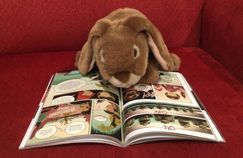 Caramel is reading Cleopatra in Space: Target Practice by Mike Maihack.