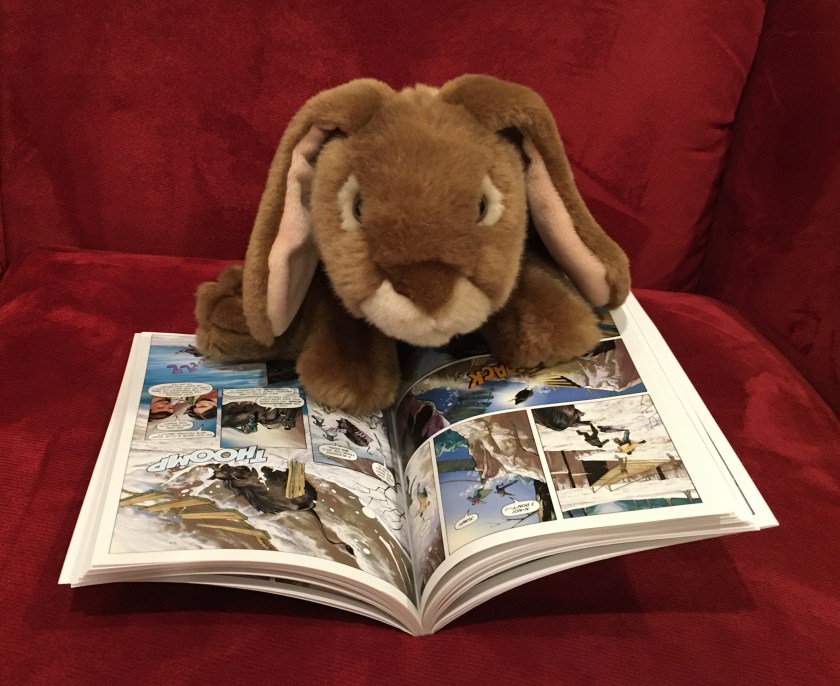 Caramel is reading The Titan's Curse: The Graphic Novel by Rick Riordan, adapted by Robert Venditti, with Attila Futaki, Greg Guilhaumond, and Chris Dickey.