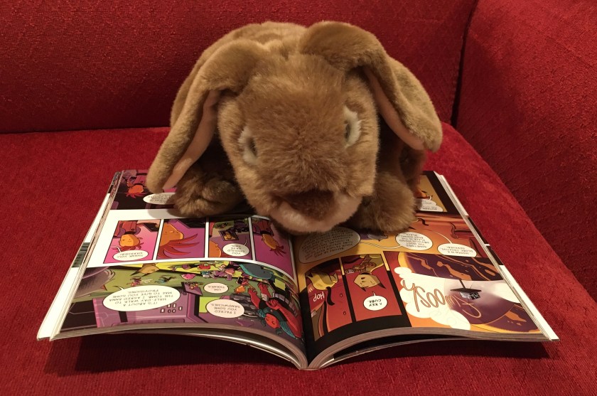 Caramel is reading Cleopatra in Space: Secret of the Time Tablets by Mike Maihack.
