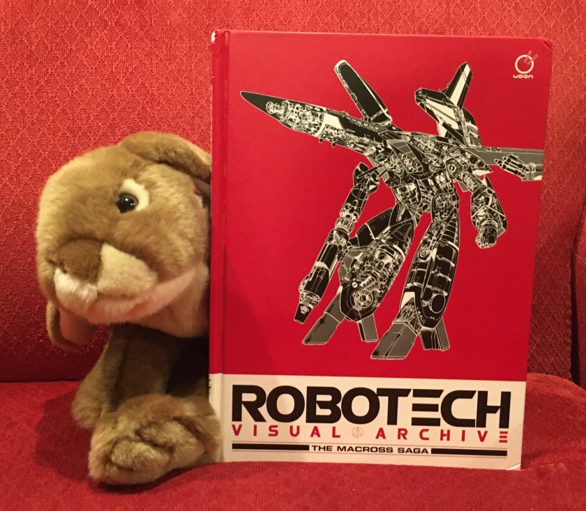 Caramel loves perusing the pages of Robotech Visual Archive: The Macross Saga, edited by Matt Moylan, and recommends it to all bunnies young and old, who like starships, robots, and especially Robotech.