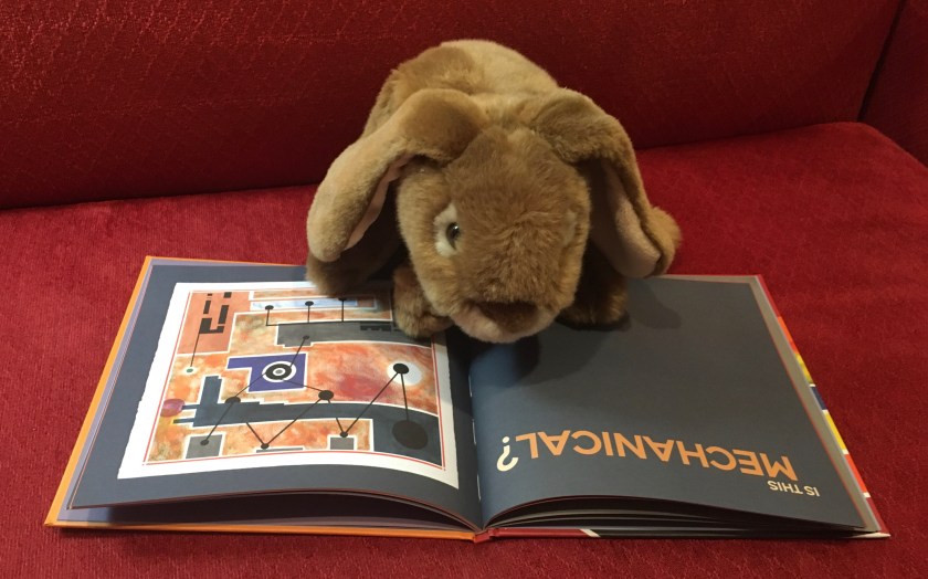 Caramel is reading Opposites Abstract by Mo Willems.