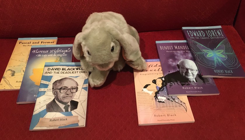 Sprinkles reviews the Mathematical Lives series by Robert Black. From left to right: Pascal and Fermat: The Probability Pen Pals (2019), Florence Nightingale: The Lady with the Diagrams (2019), David Blackwell and the Deadliest Duel (2019), Ada Lovelace: Programming the Future (2020), Benoit Mandelbrot: Reshaping the World (2021),  and Edward Lorenz and the Chaotic Butterflies (2022). 