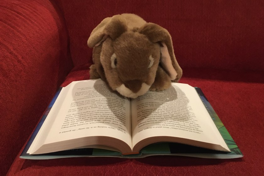 Caramel is reading The Flames of Hope (Book Fifteen of the Wings of Fire series) by Tui Sutherland.