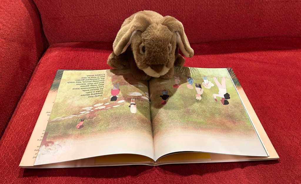 Caramel is reading Leo + Lea, written by Monica Wesolowska and illustrated by Kenard Pak.