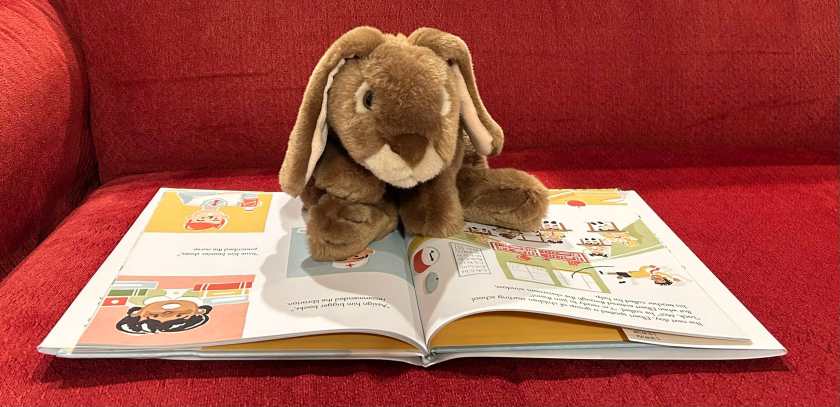 Caramel is reading Elbert in the Air, written by Monica Wesolowska and illustrated by Jerome Pumphrey.
