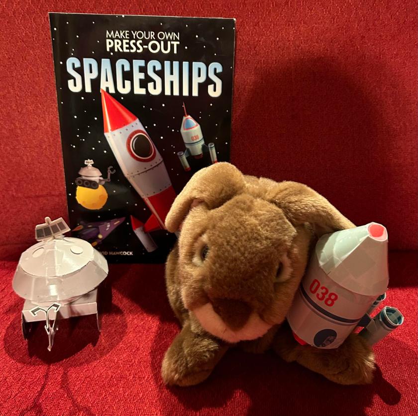 Caramel enjoyed reading Make Your Own Press-Out Spaceships by David Hawcock and made several of the spaceships already. Here he is posing with Rover the Rover and Kevin the Space Shuttle. 