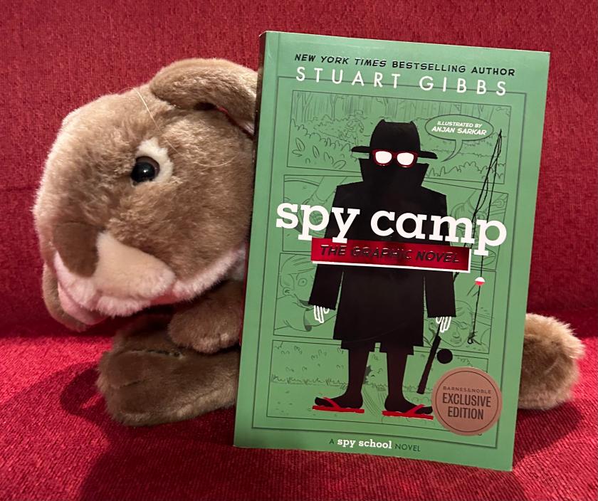 Caramel reviews Spy Camp: The Graphic Novel by Stuart Gibbs and Anjan Sarkar.