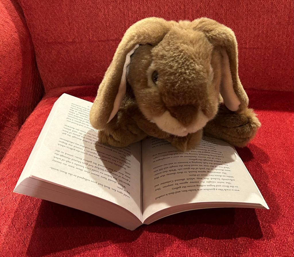 Caramel is reading Spy School: British Invasion by Stuart Gibbs. 