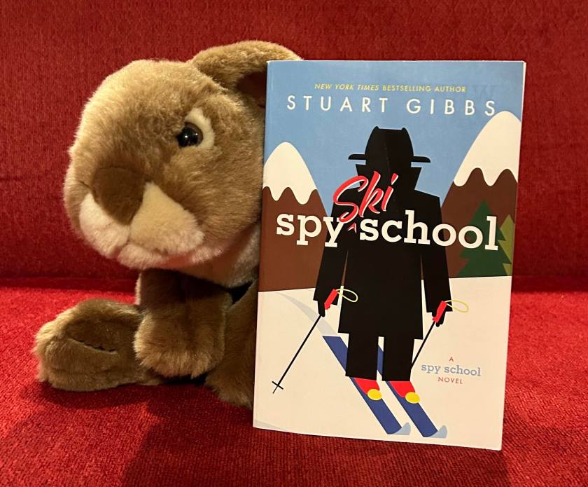 Caramel has loved reading Spy Ski School by Stuart Gibbs and cannot wait to get his paws on the fifth book of the series. 