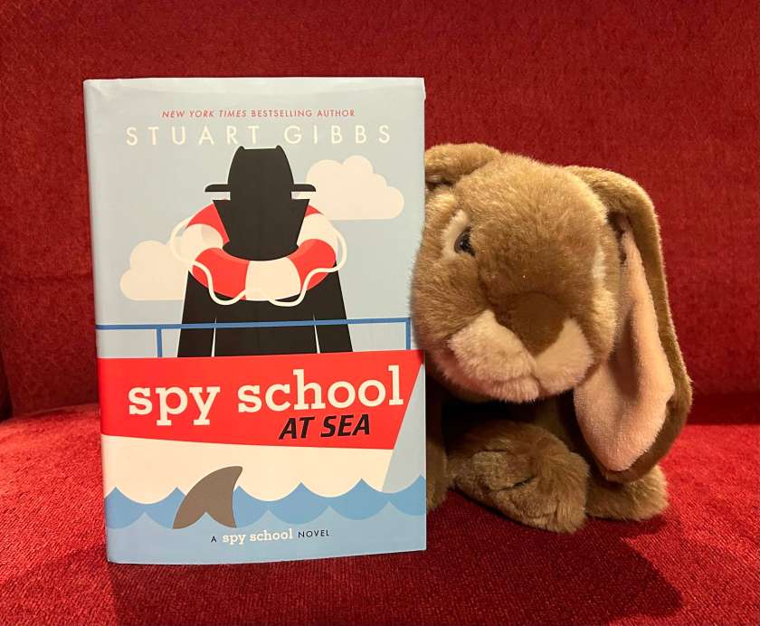 Caramel loved reading Spy School At Sea by Stuart Gibbs and can hardly wait till February 2024 to talk about the tenth book.
