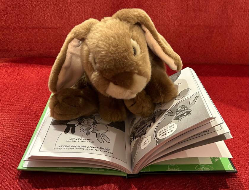 Caramel is reading Buns Gone Bad, written by Anna Humphrey and illustrated by Irma Kniivila.