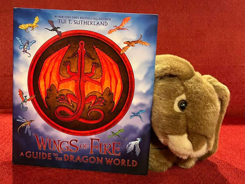 Caramel loved reading Wings of Fire: A Guide to the Dragon World, written by Tui T. Sutherland and illustrated by Joy Ang, with additional art from Mike Schley and Maarta Laiho, and recommends it to all bunnies who love all things dragon. 