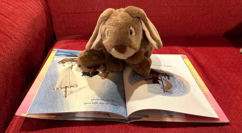 Caramel is reading I Lived Inside a Whale by Xin Li.