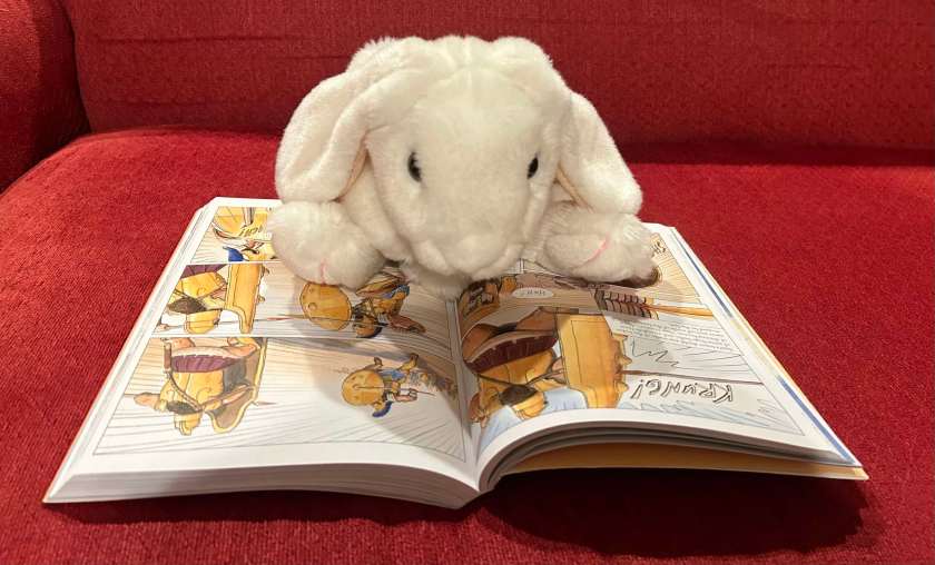 Marshmallow is reading The Iliad: A Graphic Novel Adaptation by Gareth Hinds.