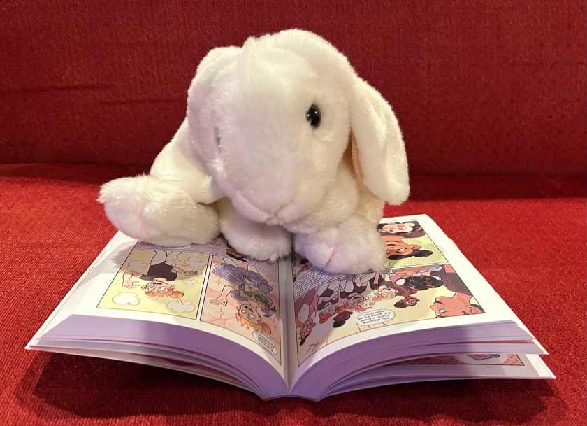 Marshmallow is reading Sweet Valley Twins: The Graphic Novel (Best Friends and Teacher’s Pet) by Nicole Andelfinger and Claudia Aguirre.