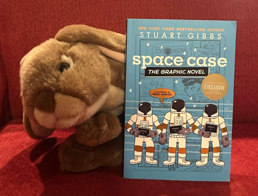 Caramel loved reading Space Case: The Graphic Novel, written by Stuart Gibbs and illustrated by Ward Jenkins, and is looking forward to reading more about Dash and his adventures. 