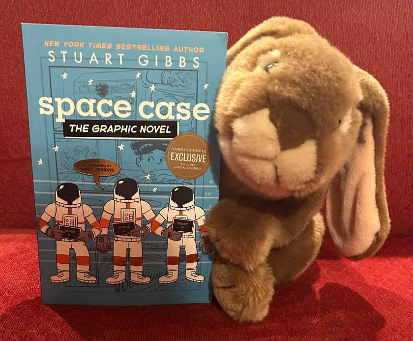 Caramel reviews Space Case: The Graphic Novel, written by Stuart Gibbs and illustrated by Ward Jenkins.