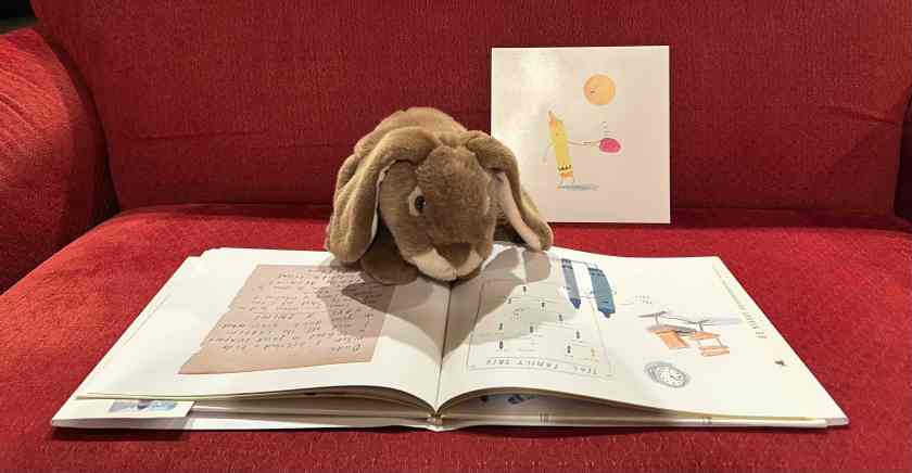 Caramel is reading The Day The Crayons Made Friends by Drew Daywalt and Oliver Jeffers.