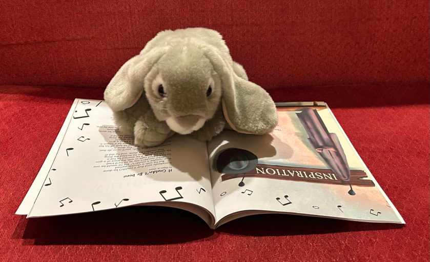 Sprinkles is reading Heroes, Horses, and Harvest Moons: A Cornucopia of Best-Loved Poems, edited and introduced by Jim Weiss and illustrated by Crystal Cregge. 