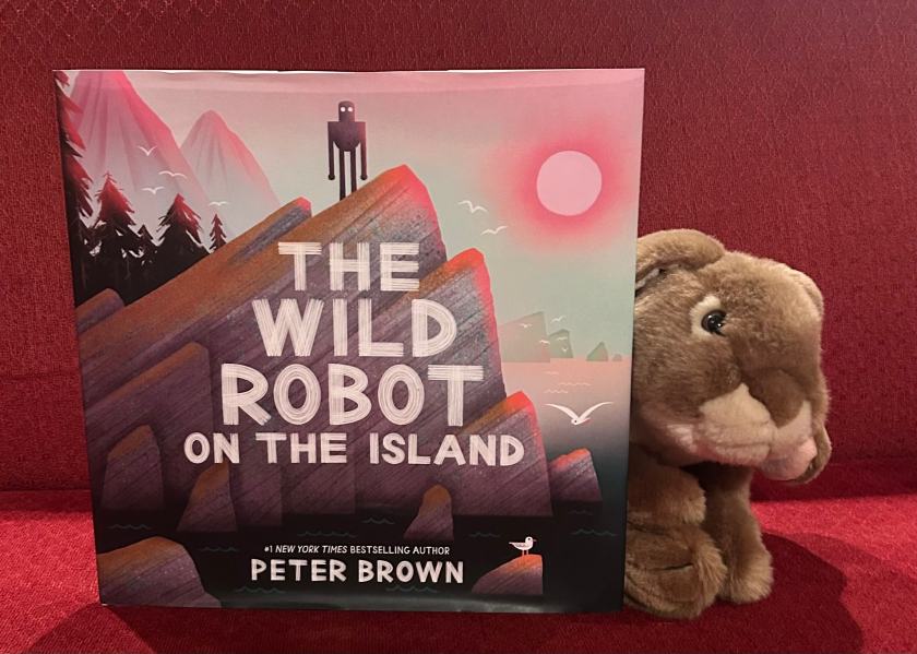 Caramel loved reading The Wild Robot on the Island: An Illustrated Picture Book Adaptation of The Wild Robot, written and illustrated by Peter Brown, and is hoping that soon there will also be new adventures for Roz and friends.