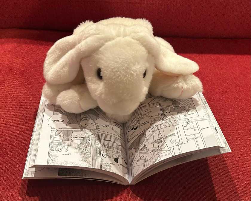 Marshmallow is reading Soseki Natsume's I Am A Cat: The Manga Edition, retold and illustrated by Chiroru Kobato, and translated into English by Zack Davisson.